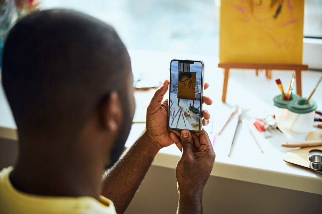 Photo of a painting on a smartphone screen
